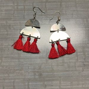 Silver earring with red fry on hanging on the bottom